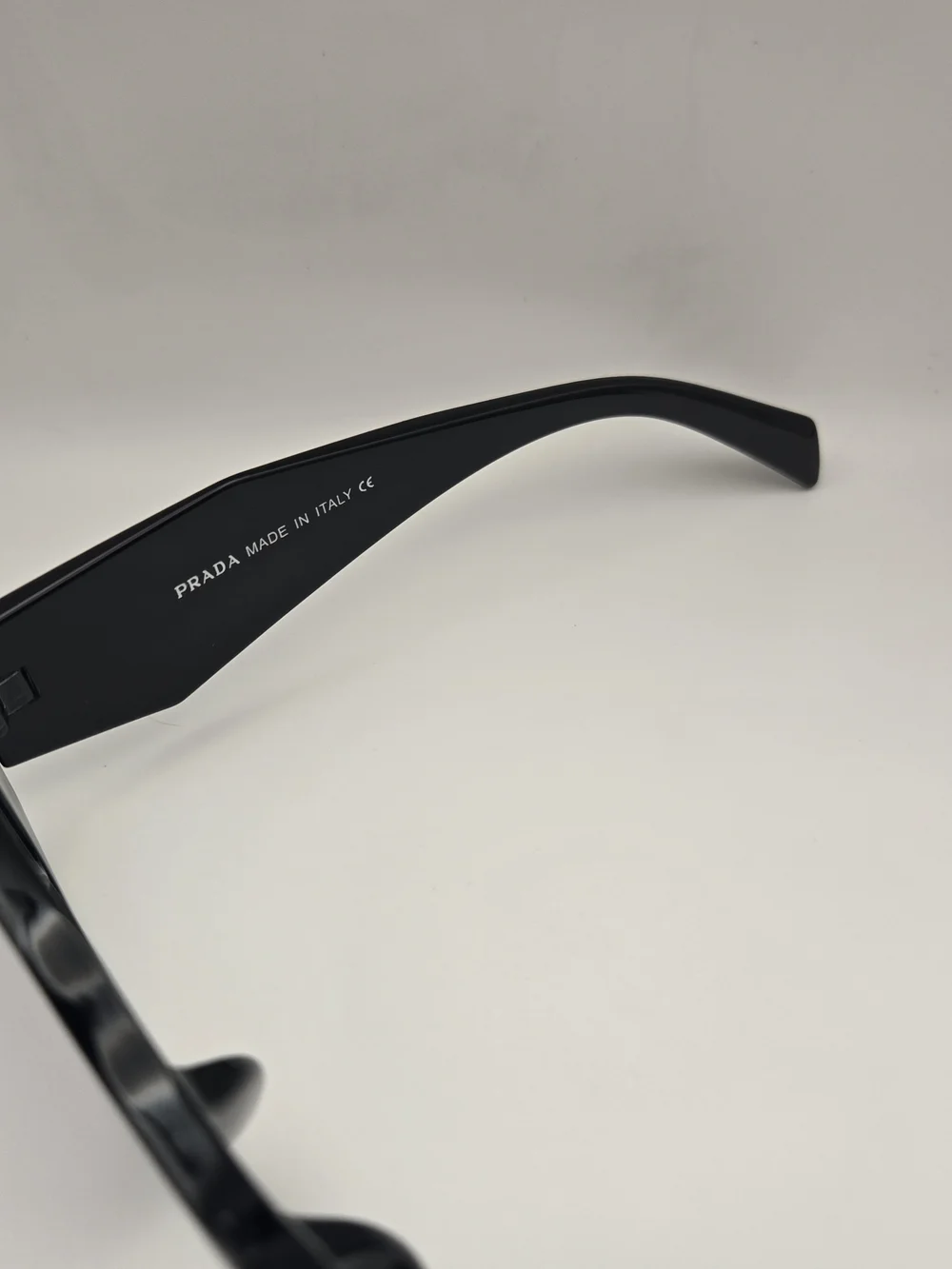Prada Black Frame Sunglasses with Purple Gradient Lenses